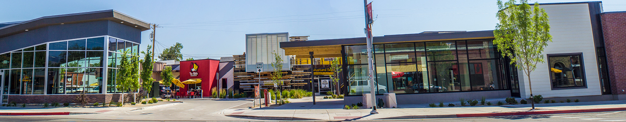 View from street of businesses with shopping and dining area located in Midtown Reno