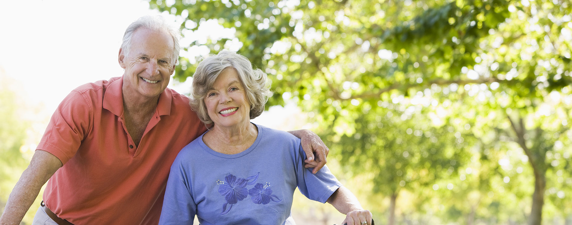 Older man and woman on bikes