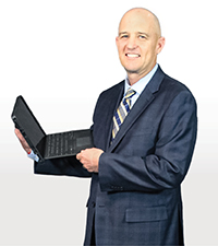 Jonathan Shipman holding a laptop