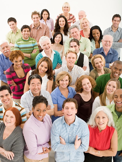 Diverse group of people standing looking up